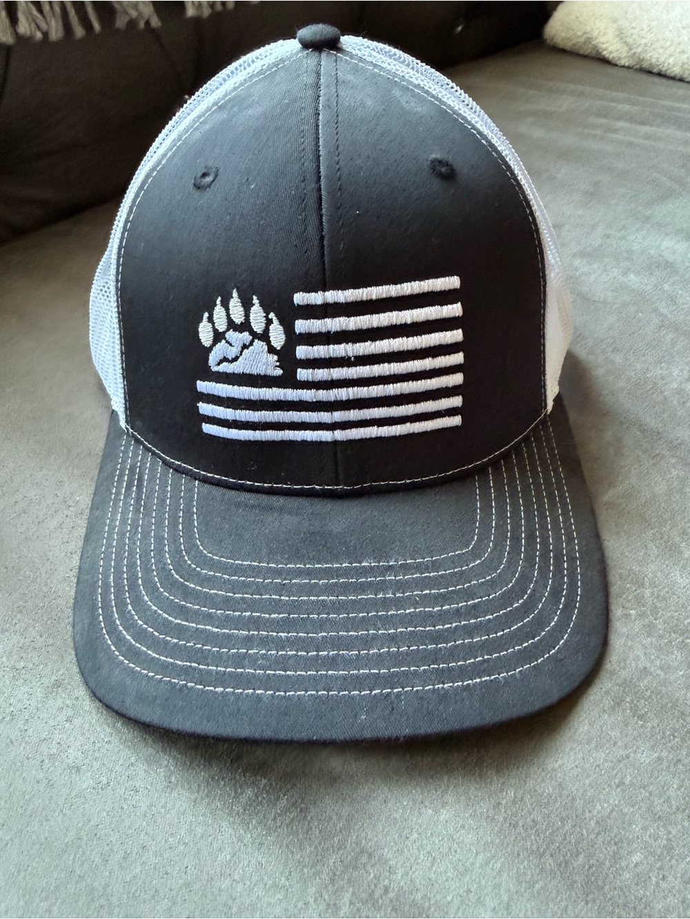 Black & White Trucker Hat with Paw Flag Embroidery